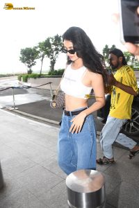 actress Disha Patani stylish in a white top and denim jeans