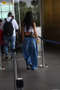 actress Disha Patani stylish in a white top and denim jeans