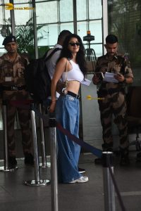 actress Disha Patani stylish in a white top and denim jeans