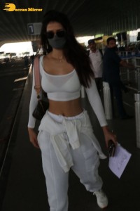 Disha Patani dressed in white at the Mumbai Airport