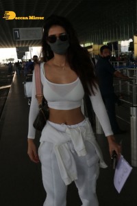 Disha Patani dressed in white at the Mumbai Airport