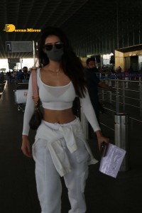 Disha Patani dressed in white at the Mumbai Airport