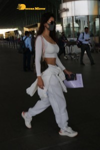 Disha Patani dressed in white at the Mumbai Airport