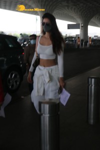 Disha Patani dressed in white at the Mumbai Airport