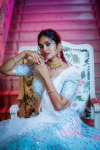 Divi Vadthya in a white lehenga choli dress