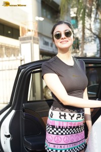 Indian actress and producer divya khosla kumar in a black top and colorful mini skirt