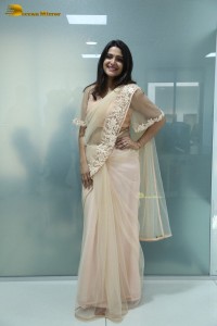 Telugu Actress Divya Pillai in a light pink saree posing for pictures