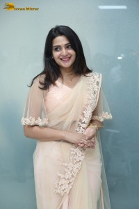 Telugu Actress Divya Pillai in a light pink saree posing for pictures