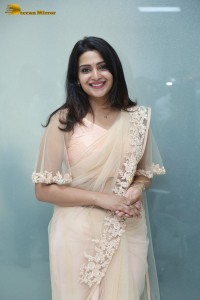Telugu Actress Divya Pillai in a light pink saree posing for pictures