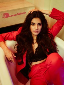 Actress Divyansha Kaushik in a Red Pant Suit