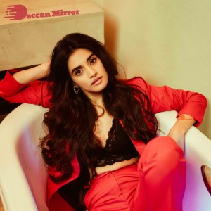 Actress Divyansha Kaushik in a Red Pant Suit