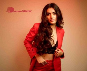 Actress Divyansha Kaushik in a Red Pant Suit