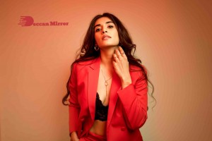 Actress Divyansha Kaushik in a Red Pant Suit