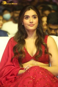 actress divyansha kaushik hot looks in a red lehenga choli at a movie function