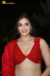 actress divyansha kaushik hot looks in a red lehenga choli at a movie function