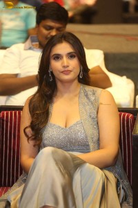 actress divyansha kaushik in a low neck dress at a movie function