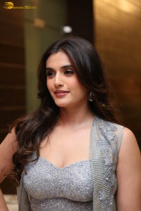 actress divyansha kaushik in a low neck dress at a movie function