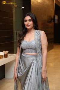 actress divyansha kaushik in a low neck dress at a movie function