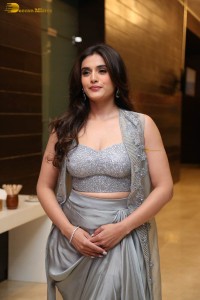 actress divyansha kaushik in a low neck dress at a movie function