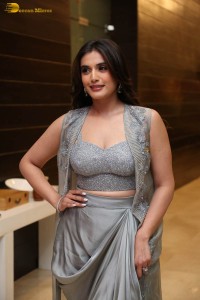 actress divyansha kaushik in a low neck dress at a movie function