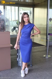 Actress Donal Bisht in a blue dress at mumbai airport on october 21