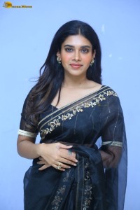 actress dushara vijayan sweet looks in a dark saree