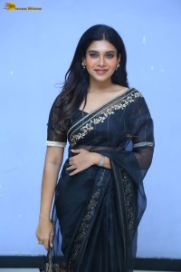 actress dushara vijayan sweet looks in a dark saree