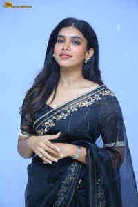 actress dushara vijayan sweet looks in a dark saree