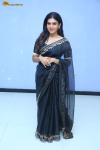 actress dushara vijayan sweet looks in a dark saree