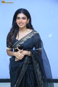 actress dushara vijayan sweet looks in a dark saree