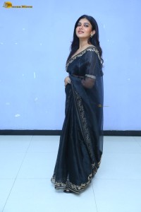 actress dushara vijayan sweet looks in a dark saree