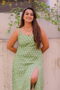 actress ester noronha sexy looks in a low neck green dress