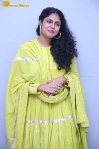 Faria Abdullah in a green dress