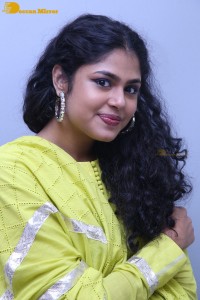 Faria Abdullah in a green dress