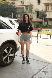 actress Giorgia Andriani cute in a black top and green shorts