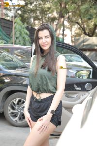 actress Giorgia Andriani beautiful in green top and black shorts