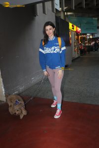 actress Giorgia Andriani pretty in a blue sweater and pink tights