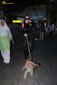 actress Giorgia Andriani with her cute dog at mumbai airport