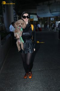 actress Giorgia Andriani with her cute dog at mumbai airport