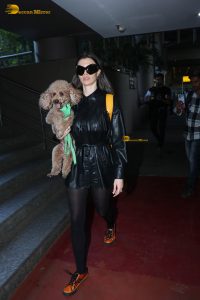 actress Giorgia Andriani with her cute dog at mumbai airport