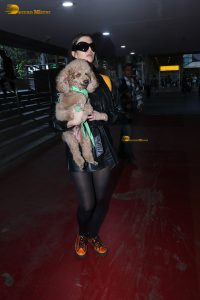 actress Giorgia Andriani with her cute dog at mumbai airport