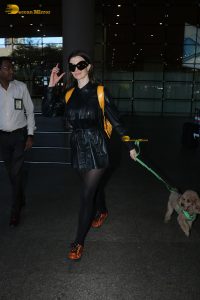actress Giorgia Andriani with her cute dog at mumbai airport