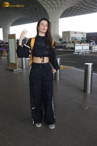 actress Giorgia Andriani in black overalls at mumbai airport