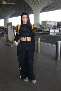 actress Giorgia Andriani in black overalls at mumbai airport