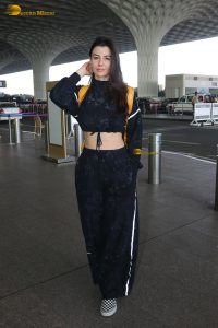 actress Giorgia Andriani in black overalls at mumbai airport