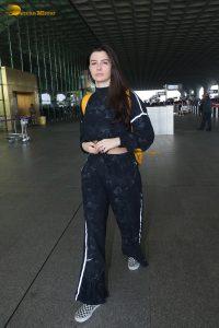 actress Giorgia Andriani in black overalls at mumbai airport