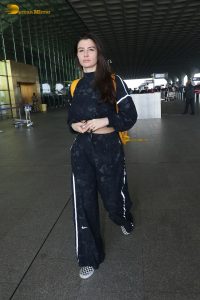 actress Giorgia Andriani in black overalls at mumbai airport