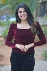 actres goldie nissy photoshoot in a maroon velvet top