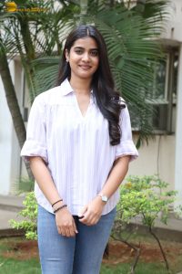 tollywood actress sri gouri priya beautiful in a white shirt and blue denim jeans