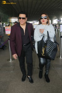 Hero No 1 Govinda and his wife Sunita Ahuja spotted at mumbai airport on Dec 25